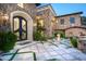 Elegant entryway with stone facade and double doors at 11200 E Canyon Cross Way, Scottsdale, AZ 85255