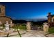 Night view of patio with fountain and city lights at 11200 E Canyon Cross Way, Scottsdale, AZ 85255