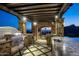 High-end outdoor kitchen with grill, granite countertops, and pergola at 11200 E Canyon Cross Way, Scottsdale, AZ 85255