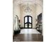 Grand entryway with chandelier and hardwood floors at 11200 E Canyon Cross Way, Scottsdale, AZ 85255