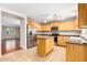 View of kitchen with island, stainless steel appliances, and wood cabinets at 4603 E Superior Rd, San Tan Valley, AZ 85143