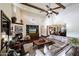 Living area with hardwood floors, fireplace, and comfortable seating at 4142 N Golf Dr, Buckeye, AZ 85396