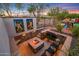 Stone firepit and seating area in backyard at 4142 N Golf Dr, Buckeye, AZ 85396