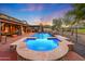 Luxury backyard oasis with a sparkling pool and spa at 4142 N Golf Dr, Buckeye, AZ 85396