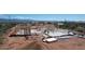 Aerial view of a house under construction, showcasing its framing and surrounding desert landscape at 28021 N 156Th St, Scottsdale, AZ 85262