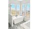 Spa-like bathroom featuring a soaking tub and large windows at 28021 N 156Th St, Scottsdale, AZ 85262