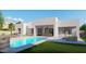 Modern home with a refreshing pool, expansive patio, and lush landscaping at 28021 N 156Th St, Scottsdale, AZ 85262