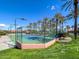 Well-maintained tennis court surrounded by lush greenery at 18326 N Gila Springs Dr, Surprise, AZ 85374