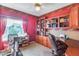 Home office features built-in wooden shelves and desk at 18326 N Gila Springs Dr, Surprise, AZ 85374