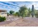 Landscaped backyard with stone pathway and mature plants at 18326 N Gila Springs Dr, Surprise, AZ 85374