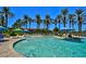 Relaxing outdoor pool with palm trees and lounge chairs at 18326 N Gila Springs Dr, Surprise, AZ 85374