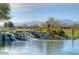 Gorgeous waterfall and pond landscape feature at 18326 N Gila Springs Dr, Surprise, AZ 85374