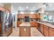 Open kitchen with granite countertops and island at 18326 N Gila Springs Dr, Surprise, AZ 85374
