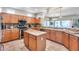 Large kitchen with granite island and stainless steel appliances at 18326 N Gila Springs Dr, Surprise, AZ 85374