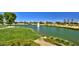 Serene lake with fountain, lush landscaping, and a peaceful atmosphere at 18326 N Gila Springs Dr, Surprise, AZ 85374