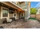 Outdoor patio with seating area, a TV, and a paved surface at 21146 W Sycamore Dr, Buckeye, AZ 85396