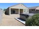Spacious backyard with a hot tub and gravel landscaping at 31021 W Columbus Ave, Buckeye, AZ 85396