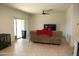Bright living room with large TV and comfy sofa at 31021 W Columbus Ave, Buckeye, AZ 85396