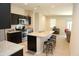 Open-concept kitchen with an island, stainless steel appliances, and granite counters at 31021 W Columbus Ave, Buckeye, AZ 85396
