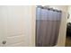 Simple bathroom with shower stall and gray curtain at 31021 W Columbus Ave, Buckeye, AZ 85396