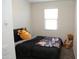 Cozy bedroom with a double bed and large window at 31021 W Columbus Ave, Buckeye, AZ 85396