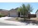 Single-story house with a two-car garage and desert landscaping at 31021 W Columbus Ave, Buckeye, AZ 85396