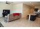 Open living area with a large TV and comfortable seating at 31021 W Columbus Ave, Buckeye, AZ 85396