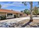 Single-story home with a brick facade, landscaped yard, and driveway at 14015 N Hampstead Dr, Fountain Hills, AZ 85268