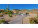 Landscaped backyard with fire pit and desert plants at 1112 E Arroyo Rd, Phoenix, AZ 85086