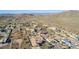 Aerial view showcasing a community of homes nestled in a desert landscape at 1112 E Arroyo Rd, Phoenix, AZ 85086