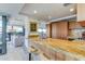 Modern kitchen with wood cabinets and granite counters at 7161 E Rancho Vista Dr # 6001, Scottsdale, AZ 85251