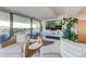 Bright living room with large windows, comfortable seating, and a fireplace at 7161 E Rancho Vista Dr # 6001, Scottsdale, AZ 85251