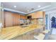 Modern kitchen with wood cabinets and granite counters at 7161 E Rancho Vista Dr # 6001, Scottsdale, AZ 85251