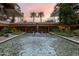 Resort-style courtyard with fountain and palm trees at 7161 E Rancho Vista Dr # 6001, Scottsdale, AZ 85251