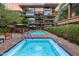 Community pool and spa with lounge chairs at 7161 E Rancho Vista Dr # 6001, Scottsdale, AZ 85251