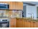 Modern kitchen with wood cabinets and granite counters at 7161 E Rancho Vista Dr # 6001, Scottsdale, AZ 85251