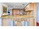 Modern kitchen with wood cabinets and granite counters at 7161 E Rancho Vista Dr # 6001, Scottsdale, AZ 85251