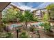 Community pool and spa with lounge chairs at 7161 E Rancho Vista Dr # 6001, Scottsdale, AZ 85251