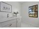 Modern bathroom vanity with quartz countertop and elegant gold fixtures at 10755 E Cholla Ln, Scottsdale, AZ 85259