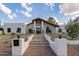 Beautiful home exterior featuring a charming walkway and landscaping at 10755 E Cholla Ln, Scottsdale, AZ 85259