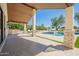 Inviting pool area with covered patio and lounge chairs at 10755 E Cholla Ln, Scottsdale, AZ 85259