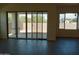 View of backyard through sliding glass doors from living room at 21042 E Camina Buena Vis, Queen Creek, AZ 85142