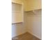 Spacious walk-in closet with shelving and hanging rods at 21042 E Camina Buena Vis, Queen Creek, AZ 85142