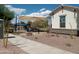 Community playground with shade structure and play equipment at 21042 E Camina Buena Vis, Queen Creek, AZ 85142