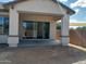 Covered patio with sliding glass doors at 21042 E Camina Buena Vis, Queen Creek, AZ 85142