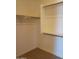 Large walk-in closet with double hanging rods and shelving at 21042 E Camina Buena Vis, Queen Creek, AZ 85142