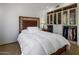 Light and airy bedroom with a walk-in closet and a comfortable bed at 7056 E Mighty Saguaro Way, Scottsdale, AZ 85266