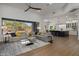 Open living area with a large sectional sofa and views to the backyard at 7056 E Mighty Saguaro Way, Scottsdale, AZ 85266