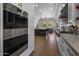 Modern kitchen features a large island and high-end stainless steel appliances at 7056 E Mighty Saguaro Way, Scottsdale, AZ 85266