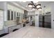 Modern kitchen with white cabinets, marble countertops, and stainless steel appliances at 7056 E Mighty Saguaro Way, Scottsdale, AZ 85266